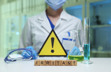A skilled lab technician highlights the hazardous irritants present in a busy chemical workspace...