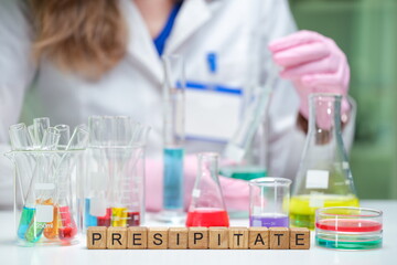 A scientist conducts experiments with colorful reagents to analyze precipitation effectively in a...