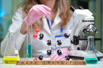An experienced expert conducts a complex phase transition experiment using advanced microscopes and...