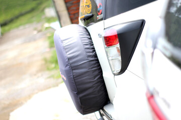 Rugged spare tire on an off-road vehicle, signaling readiness for any journey. Perfect for travel &...