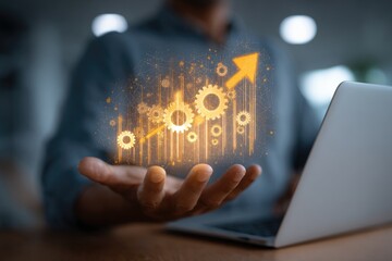 Businessperson holds upward trend graph with gears