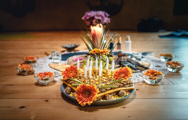 A Beautiful and Colorful Spiritual Altar Surrounded by Candles and Fresh Flowers.