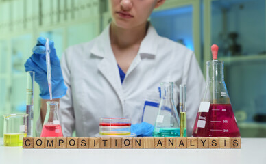 A skilled scientist performs a composition analysis with colorful chemicals in a lab, showcasing the art of science