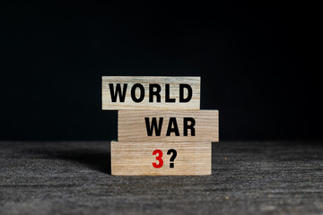world war 3 with question mark on wooden blocks isolated on dark background
