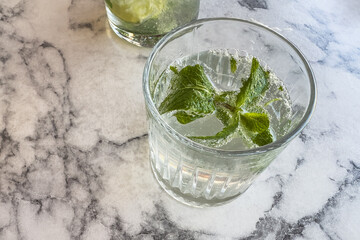 Mojito in a glass on a table in a cafe. Selective focus.