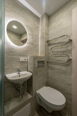 Modern Compact Bathroom with Minimalist Design Featuring Stylish Fixtures and Tiles