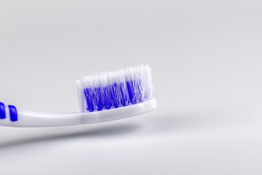 Close-up View of a Worn Toothbrush Displaying Frayed Bristles