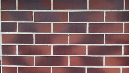 Red brick wall with white mortar lines and black spots — classic texture for architectural,...