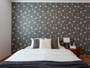 Modern Bedroom Interior with Decorative Wallpaper and Cosy Bed Decor