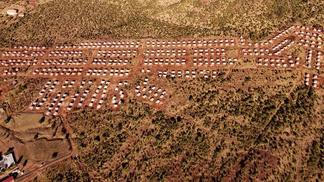 Neat patterns of government subsidized BNG housing project in rural area, aerial