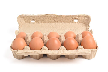 Cardboard egg box with eggs isolated on white backgound with clipping path
