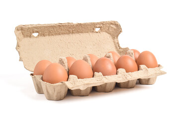 Open egg box with brown eggs isolated on white background with clipping path. Fresh organic chicken...