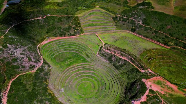 Aerial Revealing the Moray archaeological site in Peru, an ancient Inca agricultural laboratory with remarkable large-scale concentric circular terraces