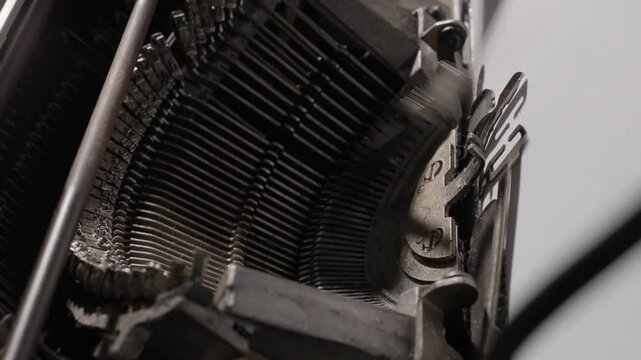Detailed close-ups of a vintage typewriter in action, focusing on keys and typed words.