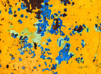 Background made of metal, painted with old paint in yellow, blue and black colors. Grunge vintage...