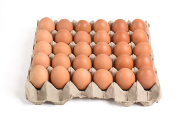 Chicken eggs in cardboard box on white background