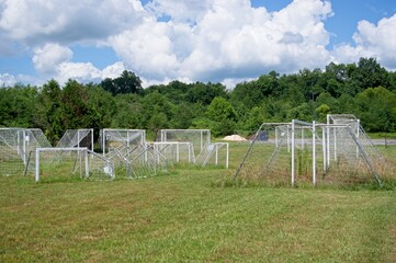 Spare soccer goals stored in a field