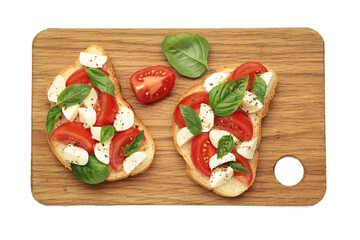Tasty sandwich with mozzarella cheese, tomatoes and basil on cutting board isolated on white...