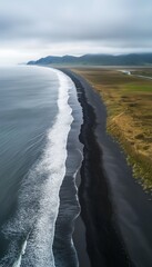 Fototapeta premium Ocean black sand beach for holiday place destination, aerial view vertical background