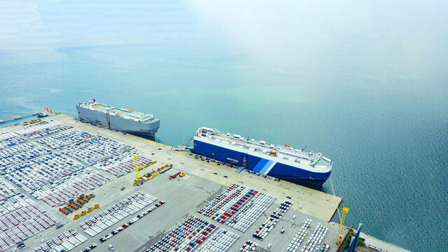 Aerial view ro-ro ship, Cargo ship transportation of business logistic sea freight, New Cars produced by year up in the port for Cargo ship and Cargo import-export around in the world