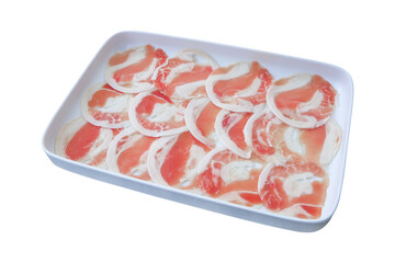 frozen sliced raw pork on white rectangle plate on transparent background.