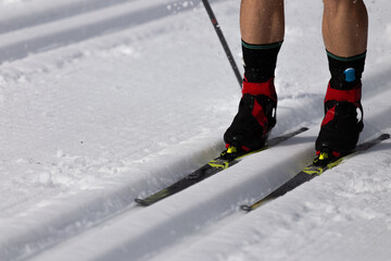 Cross-Country Skier Gliding on Snowy Track with Proper Gear and Technique