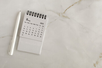 Hello, August 2025. Desktop calendar for planning on an abstract background with a copy of space.