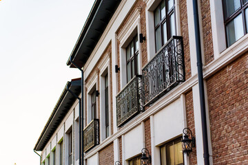 Naklejka premium A modern building in a classic style with French balconies.