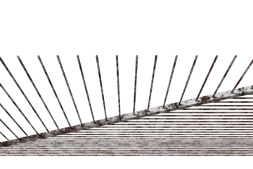 angular structure resembling a steeply inclined plane or ramp, vertical rods projecting upwards.slightly uneven in length, converge towards a central point, creating a radiating pattern