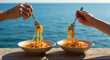Two people hands eating spaghetti by the sea