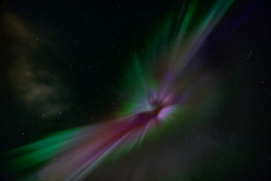 View of ethereal aurora borealis paints the night sky with vibrant strokes of green, pink, and purple, against a backdrop of twinkling stars, Reykjav&Atilde;&shy;k, Reykjav&Atilde;&shy;kurborg, Iceland.