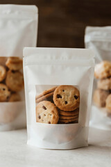 chocolate chip cookies Handmade baking of bread and cookies, coffee shops, dessert shops, transparent window packaging bags, take out,product mockup photo E-commerce marketing poster Background
