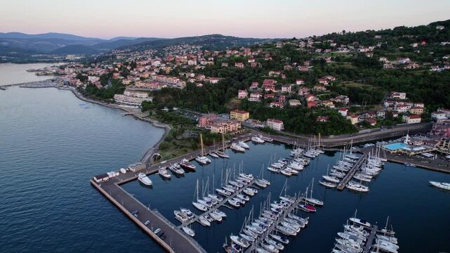 Italian town of Muggia near Trieste, sunset on a marina, Mediterranean coastline setting