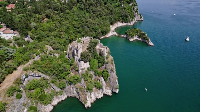 Castle Duino, Italy, bright sunny day, European historic castle, drone UHD shot