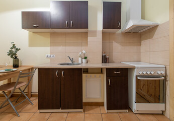 Modern Kitchen Interior with Wooden Cabinets and Dining Table Providing Functionality