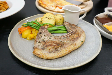 pork steak or grilled pork and salad or pork chop