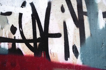 Abstract urban graffiti in red, black, teal on concrete wall. Raw street art, 90s vibe, bold lines,...