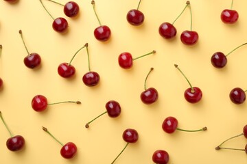 Fresh ripe cherries on beige background, flat lay