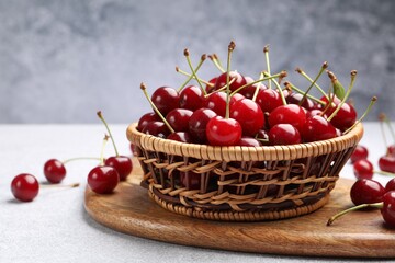 Fresh ripe cherries on light table, closeup