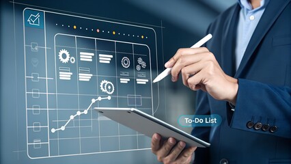 Fototapeta premium A business professional interacts with a virtual screen, managing data, charts, and a to do list using a digital pen for efficient workflow.