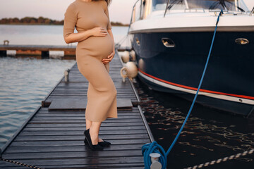 A pregnant woman on the pier.