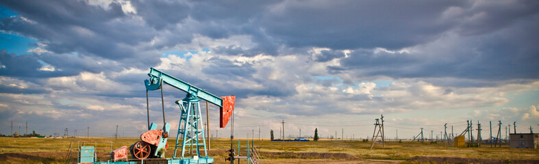 oil pump against sky background banner