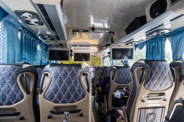 Chiayi, Taiwan – Jun 29, 2025: Interior view of a Taiwanese tour bus showing patterned seats,...