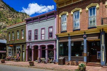 Old brick buildings, once a mining boom town, now a charming tourist destination. The buildings showcase early American architectural styles.