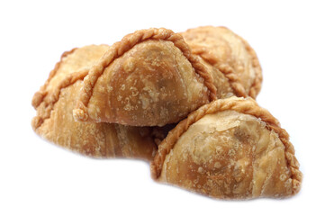 Homemade golden, flaky curry puffs or karipap in Thai, isolated on white background. Concept, traditional snack perfect for food styling, bakery menus, or cultural food.                               