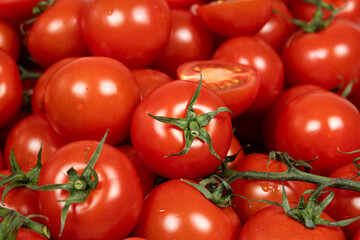 Lots of ripe fresh cocktail tomatoes close-up.