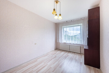 Bright Minimalist Room with Wooden Flooring and Large Window View