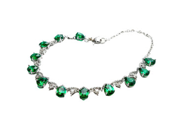 Stylish green emerald anklet displayed on transparent background
