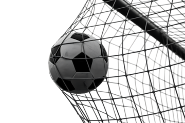 Monochromatic soccer ball strikes the net and makes a goal in a dramatic display of athletic prowess and precision, contrasted against a black background