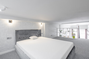 Modern Minimalist Loft Bedroom Interior With Stylish Decor and Cozy Atmosphere